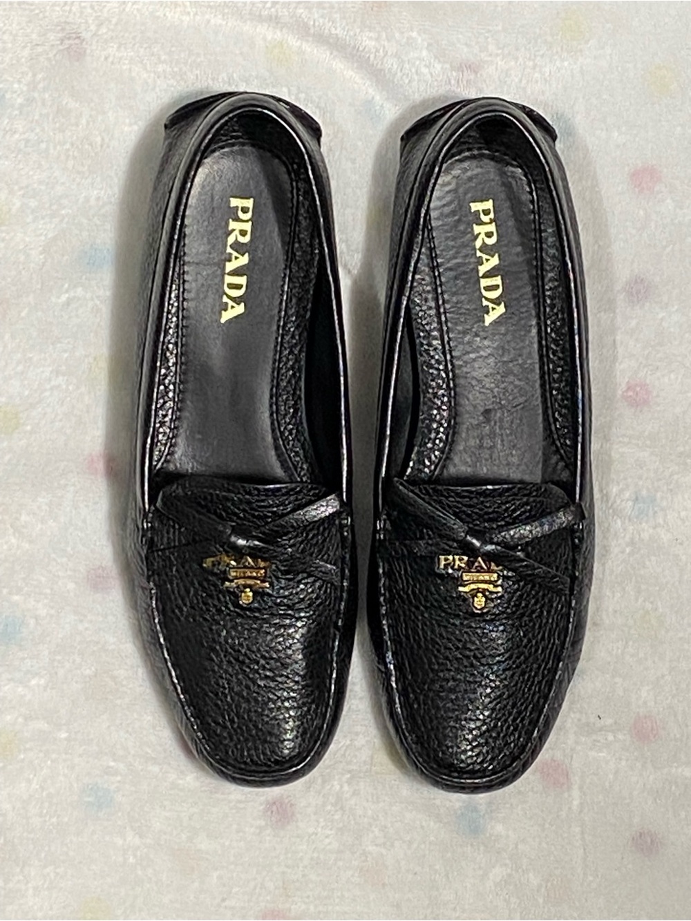Prada Black Leather Pebbled Loafers with Gold Logo